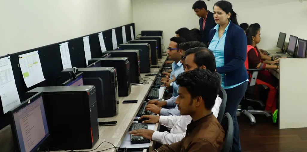 ORNET staff working at a long row of computer workstations
